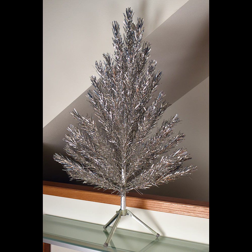 Four-foot silver Evergleam aluminum Christmas tree with straight needles, early 1960s. (Private collection)