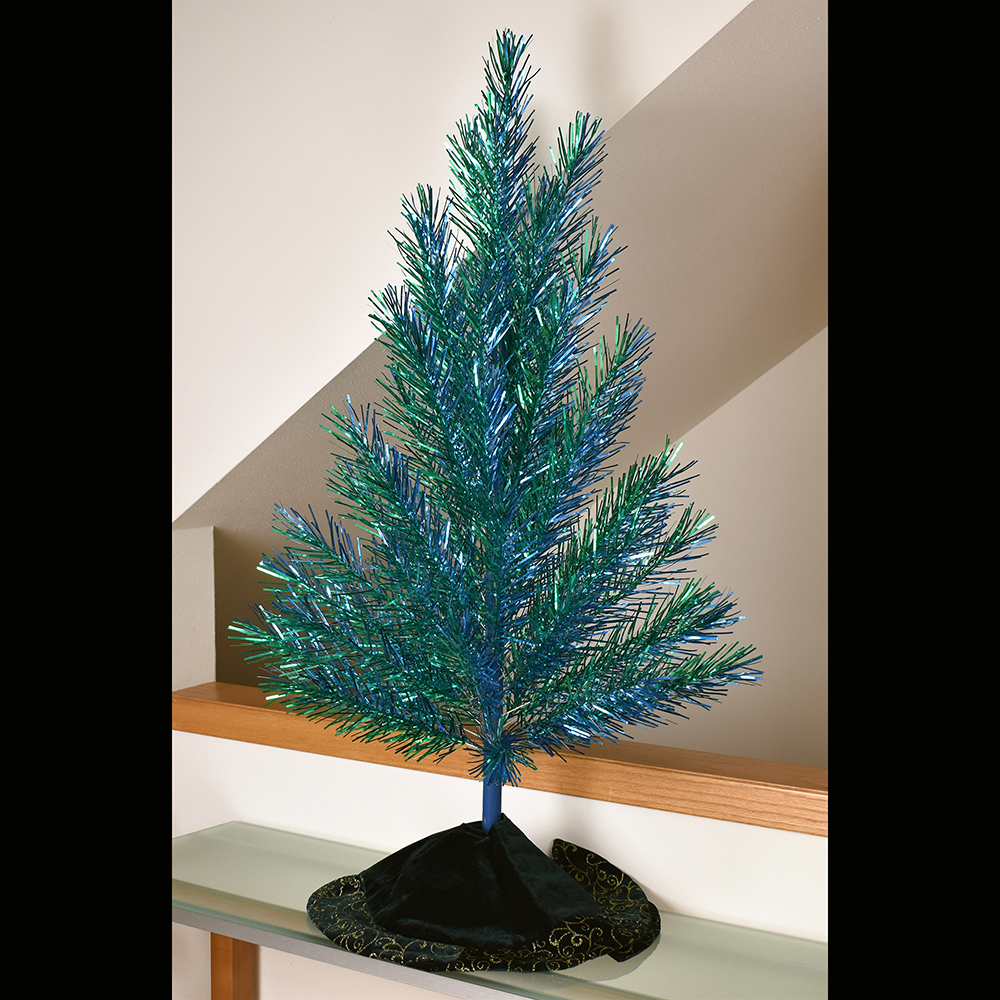 Evergleam aluminum Christmas tree, late 1960s Four-foot Dual-Color The Dual-Color was perhaps one of Aluminum Specialty's last major innovations to the Evergleam in the late 1960s. It’s likely that few were produced as they rarely appear today in the online marketplace. Private Collection