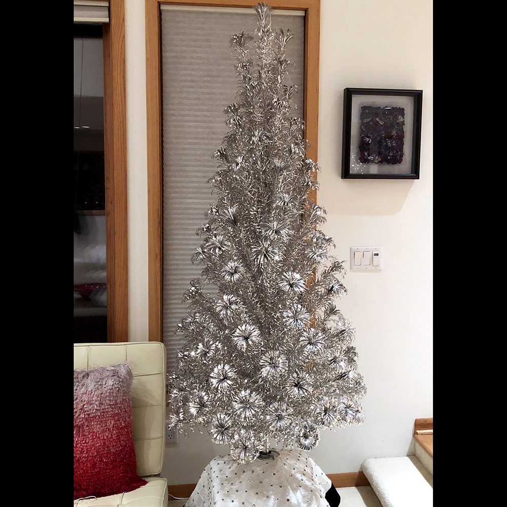 Five-and-one-half-foot silver Slim-Line, Evergleam aluminum Christmas tree, early 1960s. With its shorter branches, this Evergleam has a very sleek appearance and takes up less floor space than other models. The Slim-Line is the only model that came in half-foot heights. (Private collection)