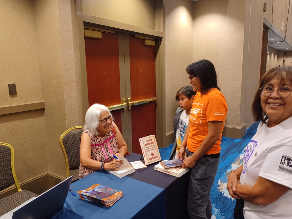 A Wisconsin Historical Society Press author meets with guests during an author appearance.